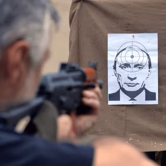 airsoft marksman firing at the face of russian terrorist putin